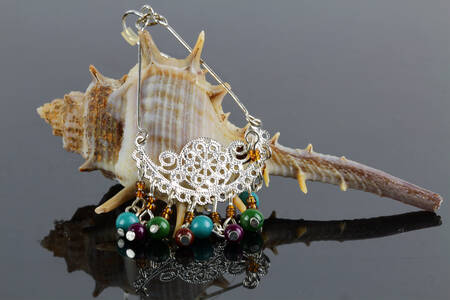 Minđuša na školjki